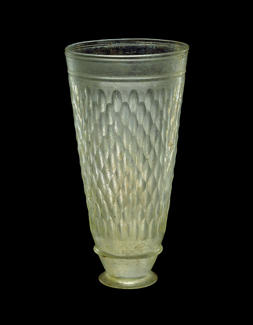 Translucent conical glass with a textured pattern throughout, tapering to a circular base