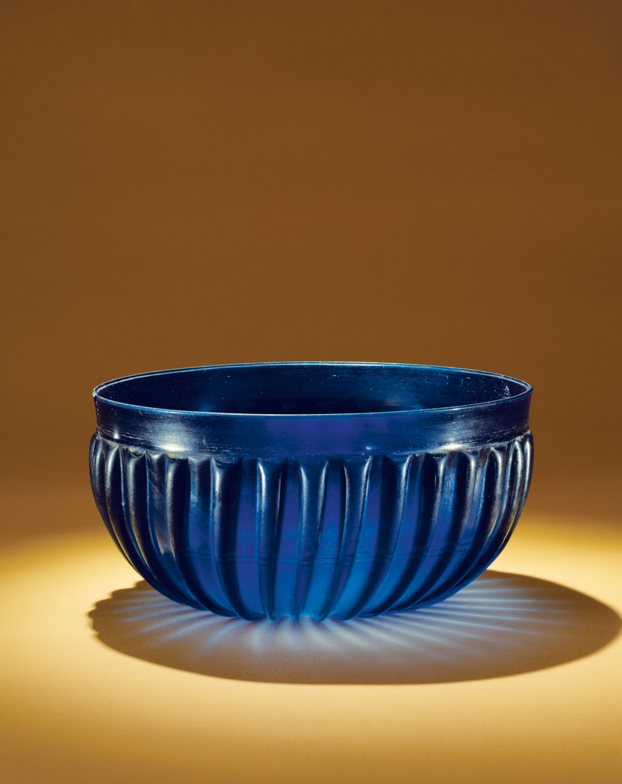 Deep cobalt blue bowl with vertical ribbed detailing