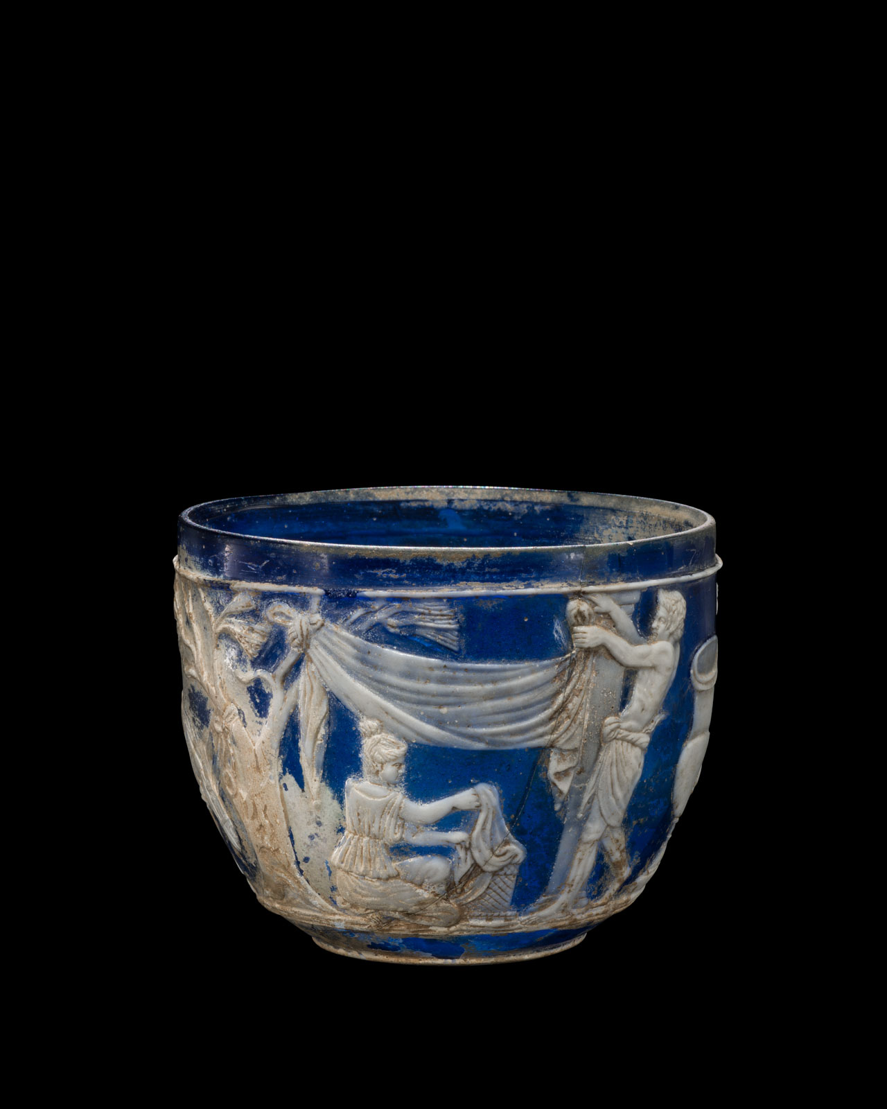 Blue glass bowl with white relief figures draped in classical garments