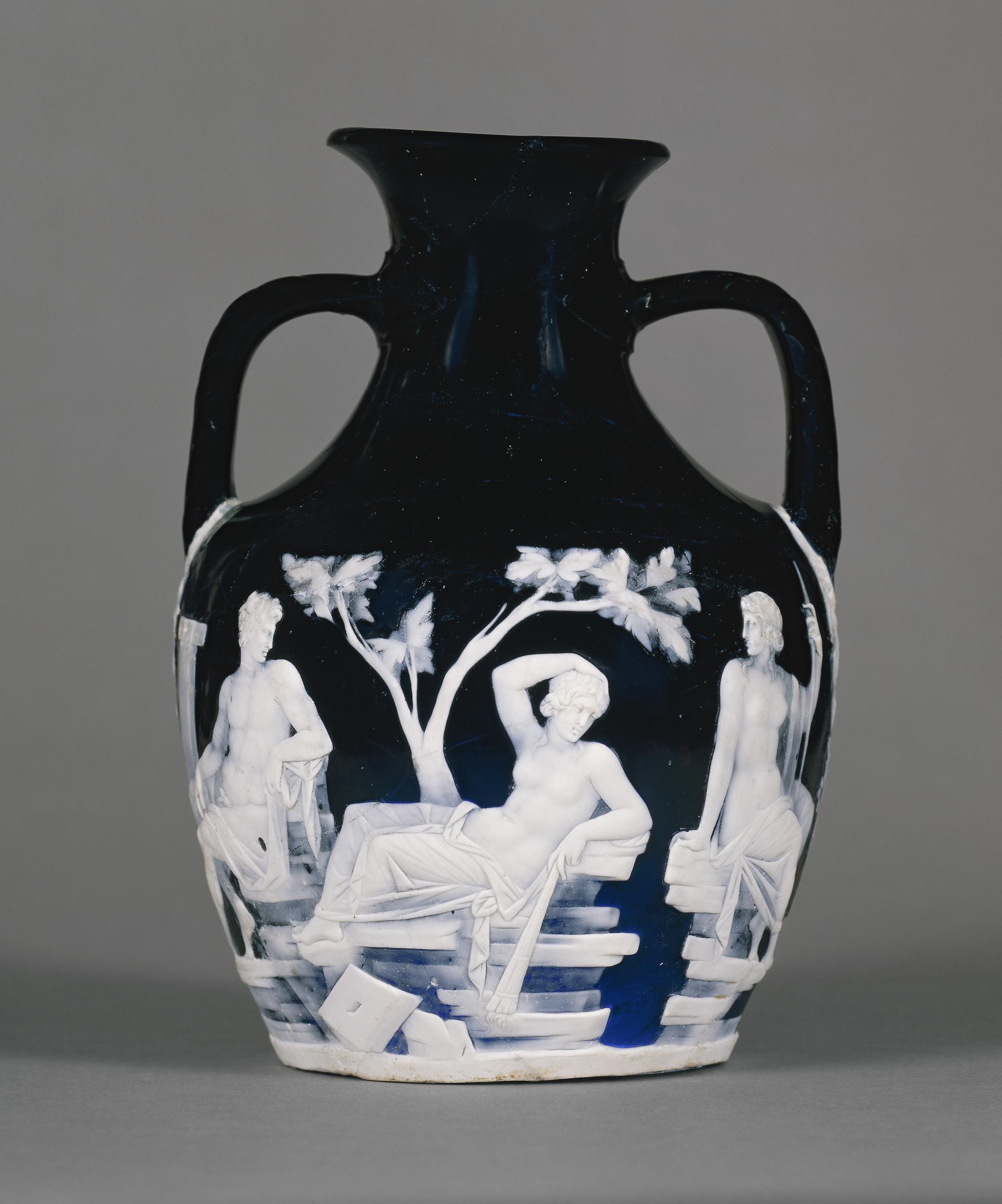 Dark glass vase with two handles and detailed white relief depicting classical figures