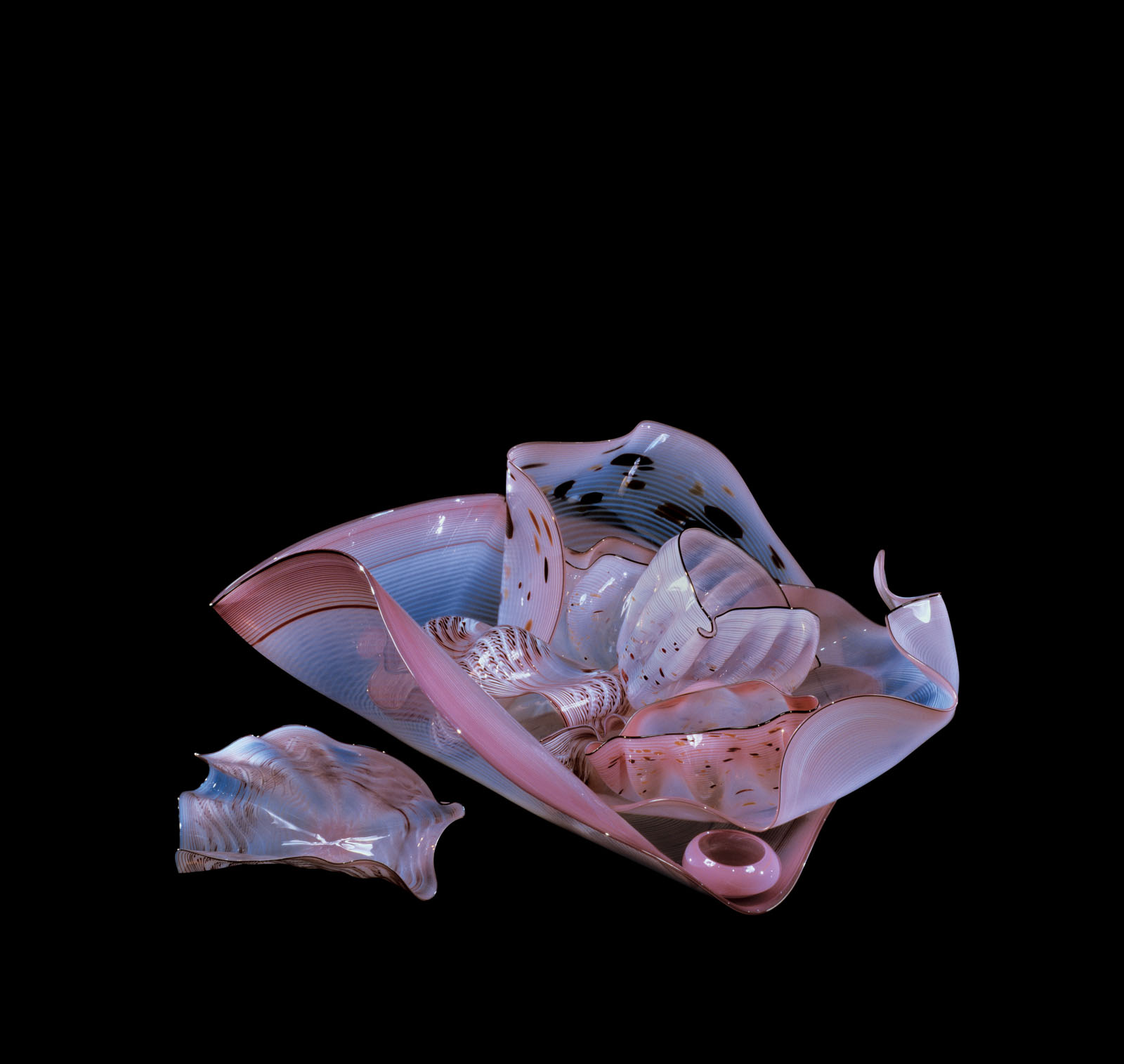 Abstract glass shape with swirling pink and blue hues in undulating form