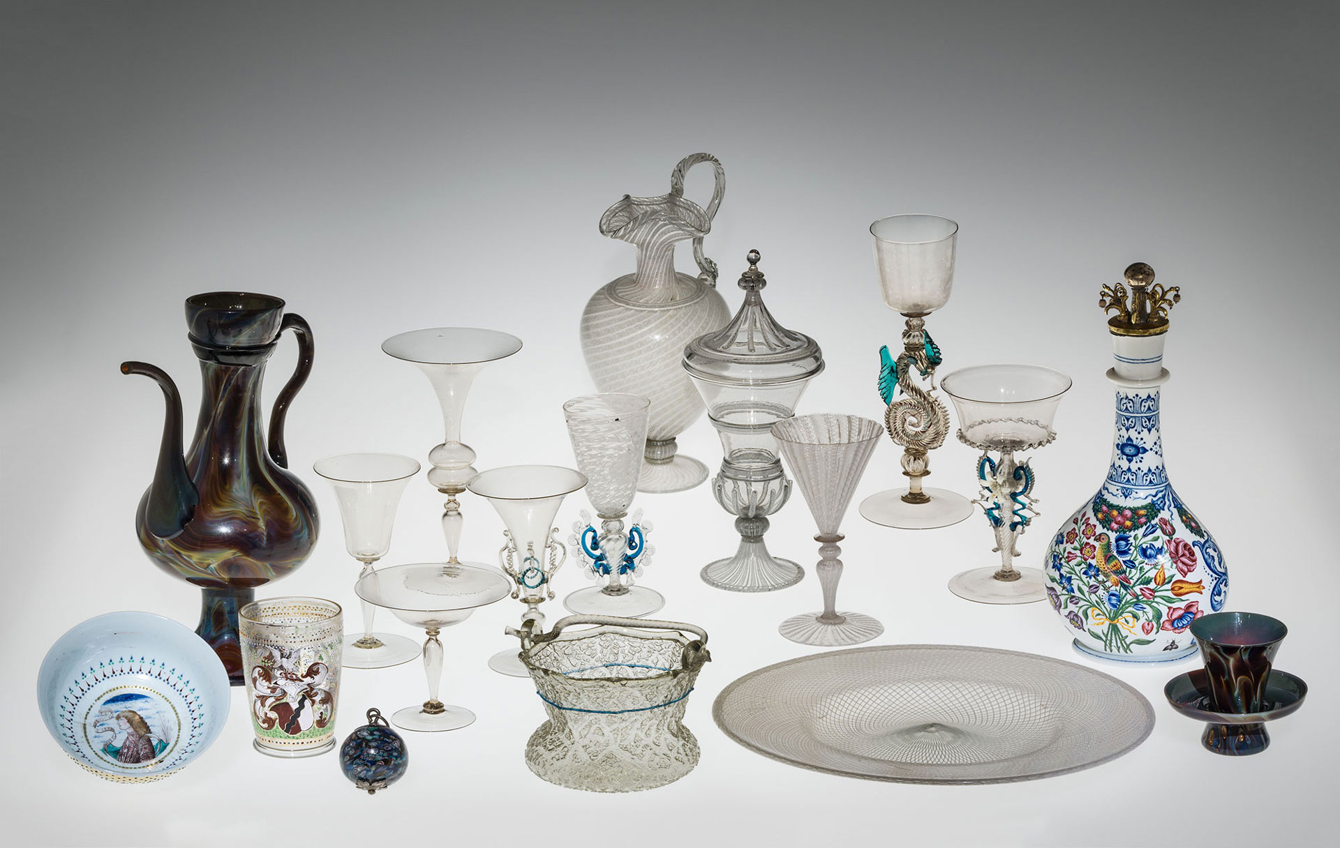 Diverse collection of goblets, pitchers, bowls, cups, and containers featuring an array of ornate styles, colors and designs